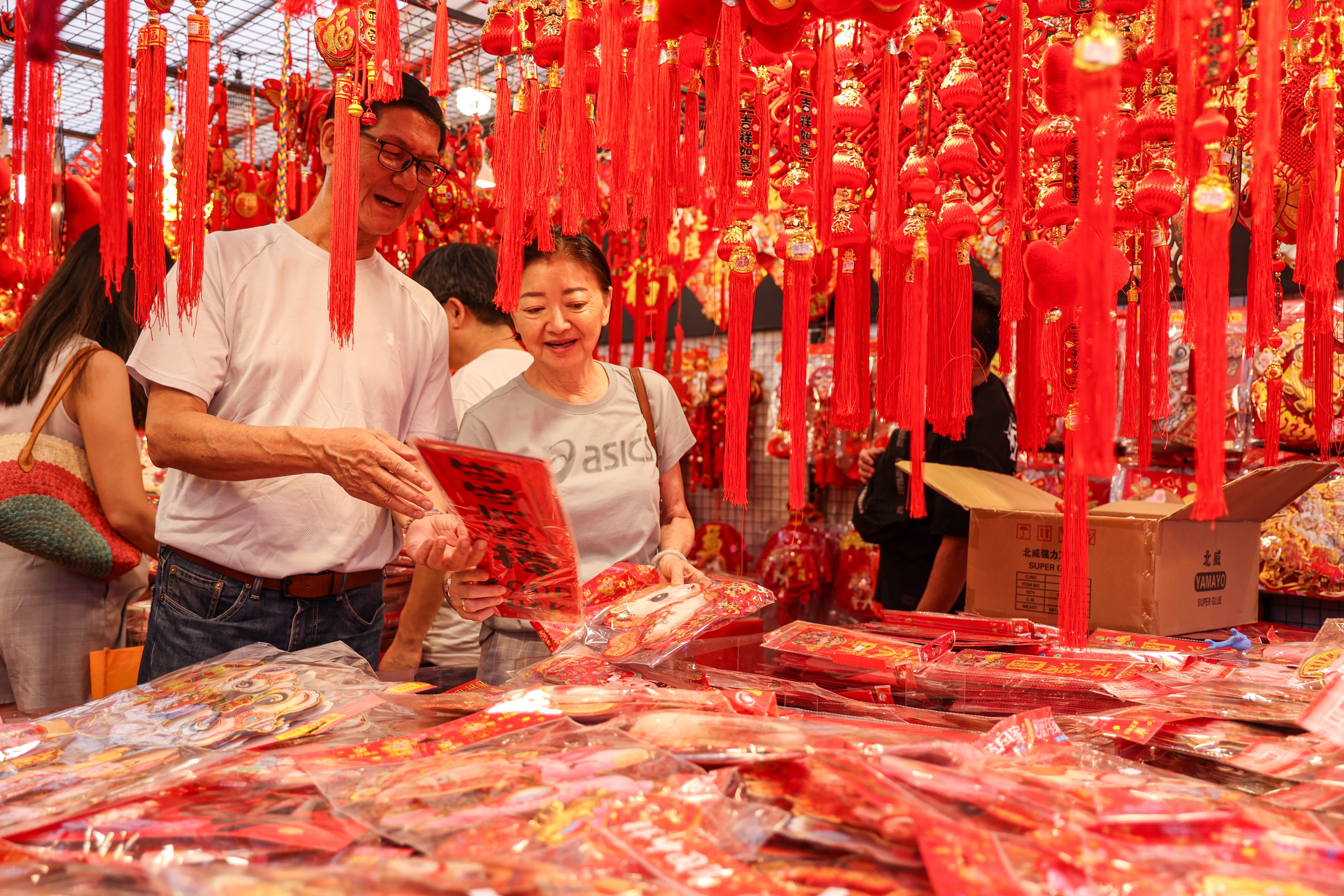 Photo of Families shopping for Chinese New Year decors at Chinatown